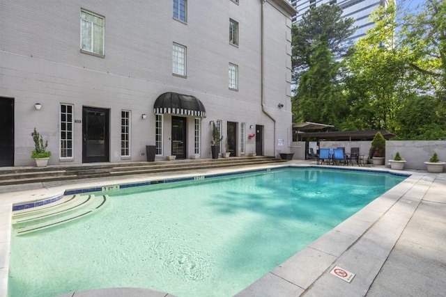 view of pool featuring a patio area