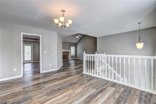 154 Jerry Allen Rdg, Dallas, GA 30132 - unfurnished room with a ceiling fan, plenty of natural light, wood finished floors, and vaulted ceiling