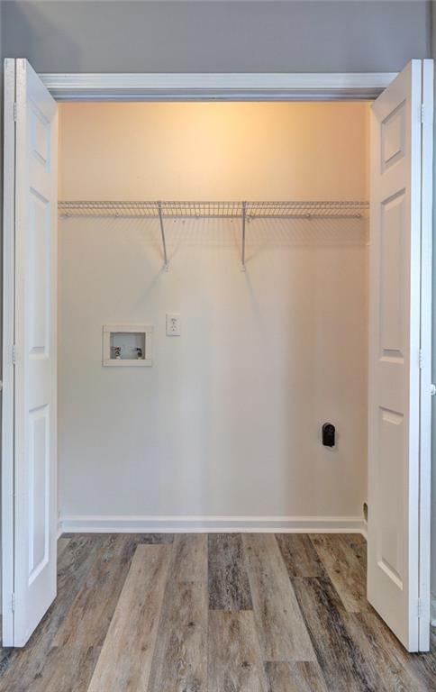 154 Jerry Allen Rdg, Dallas, GA 30132 - washroom featuring washer hookup, electric dryer hookup, baseboards, and wood finished floors