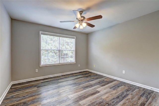 154 Jerry Allen Rdg, Dallas, GA 30132 - spare room featuring dark wood-type flooring, baseboards, and a ceiling fan