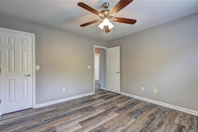 154 Jerry Allen Rdg, Dallas, GA 30132 - unfurnished bedroom with wood finished floors, baseboards, and ceiling fan