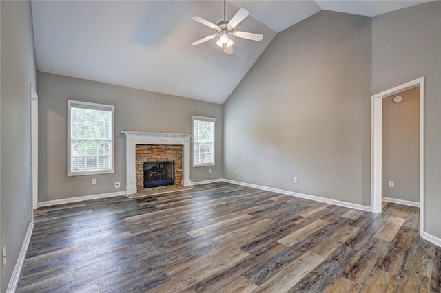 154 Jerry Allen Rdg, Dallas, GA 30132 - unfurnished living room with healthy amount of natural light, a ceiling fan, high vaulted ceiling, dark wood-style floors, and a fireplace