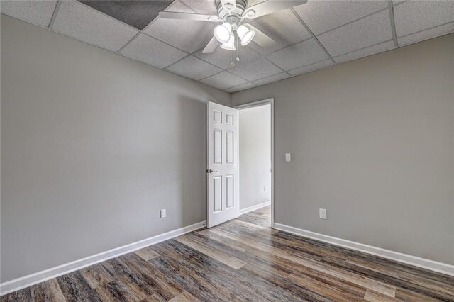 154 Jerry Allen Rdg, Dallas, GA 30132 - spare room with a drop ceiling, wood finished floors, baseboards, and ceiling fan