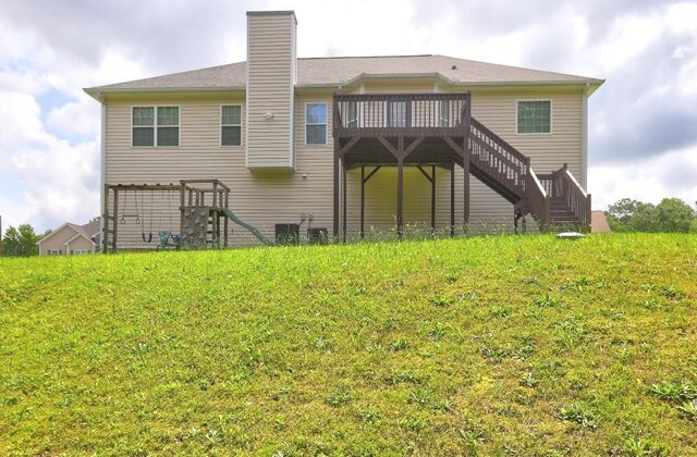 154 Jerry Allen Rdg, Dallas, GA 30132 - back of property featuring stairway, a wooden deck, and a chimney