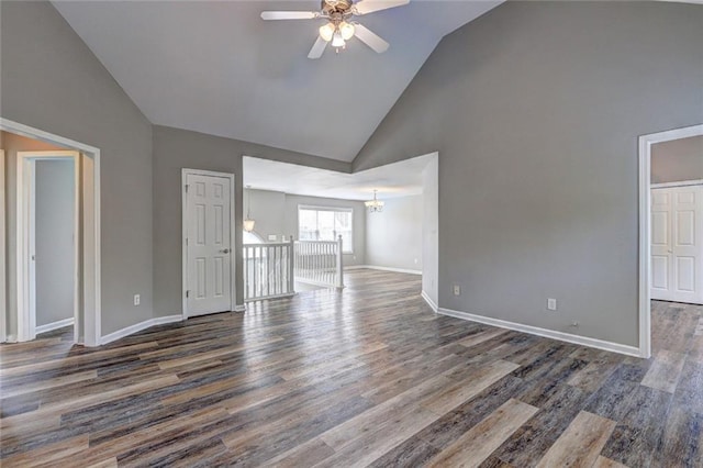 154 Jerry Allen Rdg, Dallas, GA 30132 - unfurnished room featuring high vaulted ceiling, ceiling fan, a chandelier, dark wood-type flooring, and baseboards