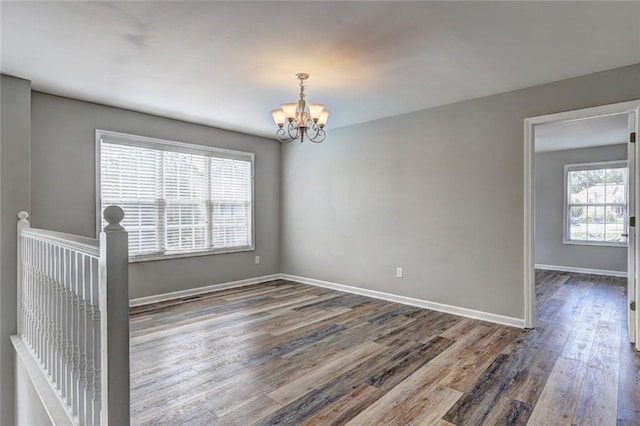 154 Jerry Allen Rdg, Dallas, GA 30132 - spare room with a chandelier, wood finished floors, and baseboards