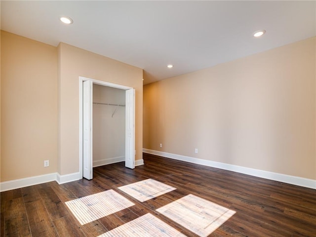 689 Berne St SE, Atlanta, GA 30312 - unfurnished bedroom featuring dark wood-style floors, a closet, and recessed lighting