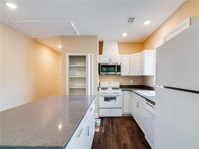689 Berne St SE, Atlanta, GA 30312 - kitchen with white appliances, white cabinets, dark wood-style flooring, dark stone counters, and recessed lighting