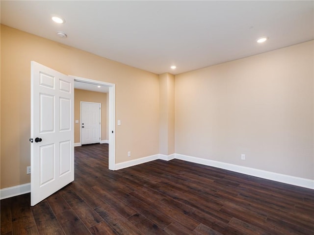 689 Berne St SE, Atlanta, GA 30312 - unfurnished room with a smoke detector, dark wood finished floors, and recessed lighting