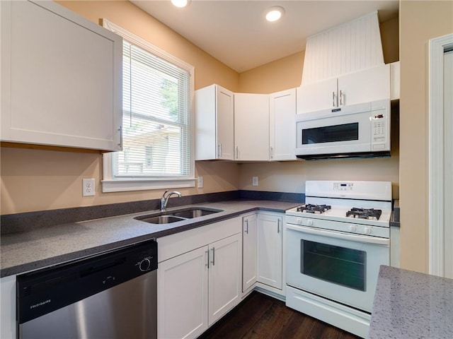 689 Berne St SE, Atlanta, GA 30312 - kitchen featuring white appliances, white cabinetry, dark wood-style flooring, and recessed lighting