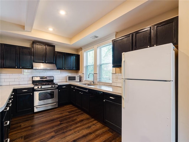 689 Berne St SE, Atlanta, GA 30312 - kitchen featuring white appliances, under cabinet range hood, backsplash, recessed lighting, and beamed ceiling