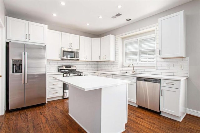 4609 Mctyre Way, Marietta, GA 30064 - kitchen with white cabinets, recessed lighting, visible vents, a sink, and stainless steel appliances