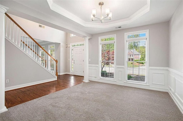 4609 Mctyre Way, Marietta, GA 30064 - foyer with decorative columns, visible vents, carpet flooring, stairs, and a raised ceiling