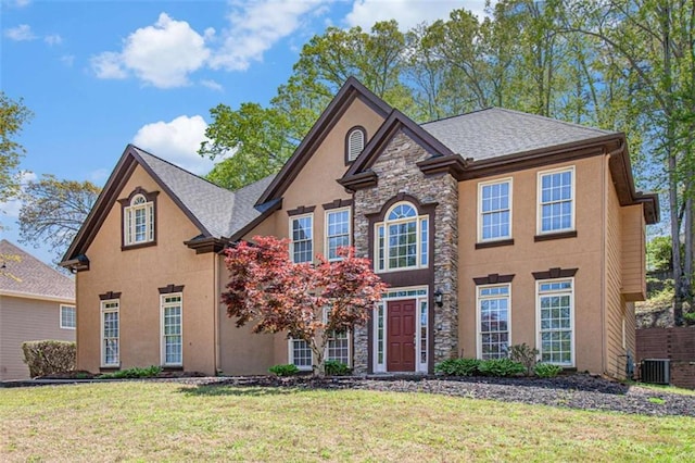 4609 Mctyre Way, Marietta, GA 30064 - view of front of home featuring stone siding, fence, cooling unit, stucco siding, and a front lawn