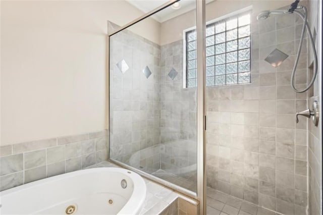 bathroom featuring a shower stall and a whirlpool tub