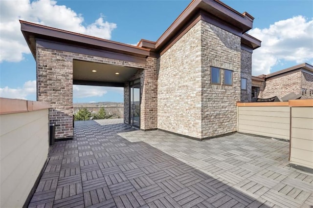 view of patio featuring fence