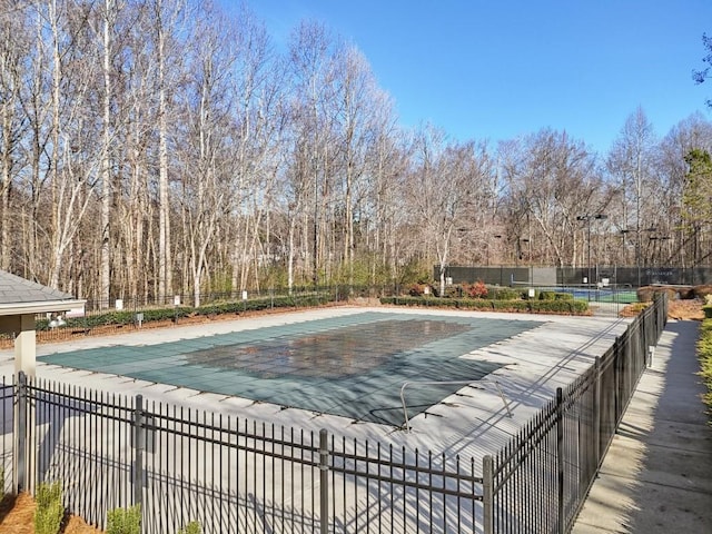 community pool with fence