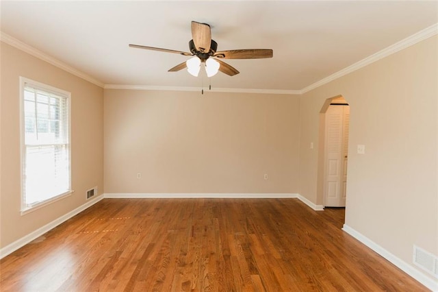 unfurnished room with dark wood-type flooring, ceiling fan, and ornamental molding