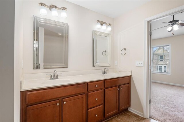 bathroom with ceiling fan and vanity