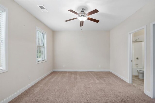 carpeted empty room with ceiling fan