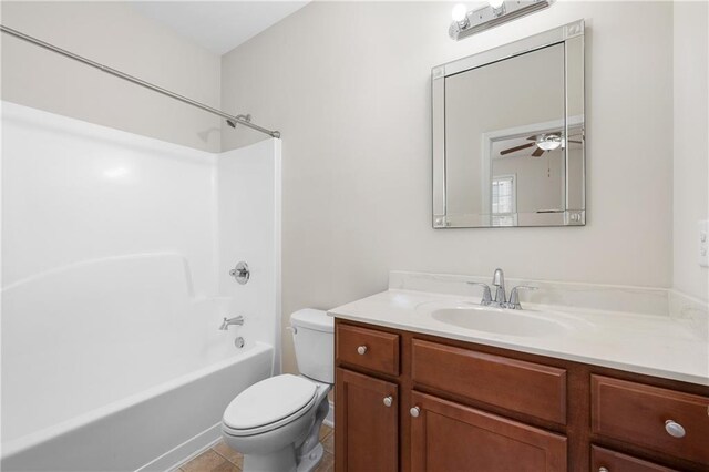 full bathroom featuring toilet, ceiling fan, bathtub / shower combination, tile patterned flooring, and vanity