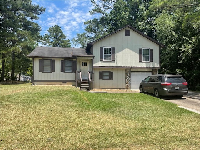 split level home featuring a garage and a front lawn