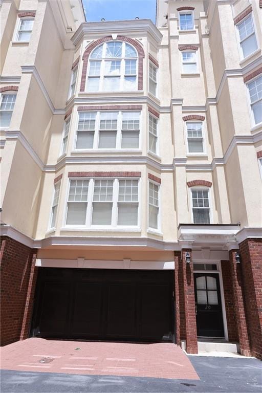 3541 Roswell Rd NE Unit 20, Atlanta, GA 30305 - view of front of house with a garage and brick siding