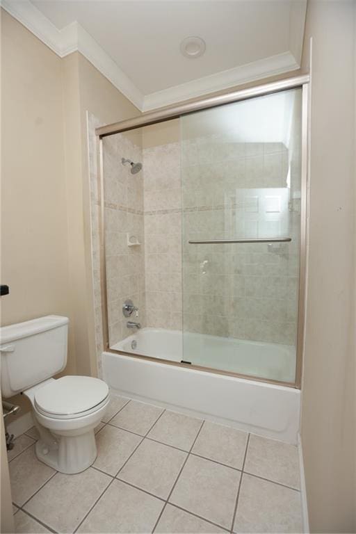 3541 Roswell Rd NE Unit 20, Atlanta, GA 30305 - bathroom featuring crown molding, toilet, enclosed tub / shower combo, and tile patterned floors