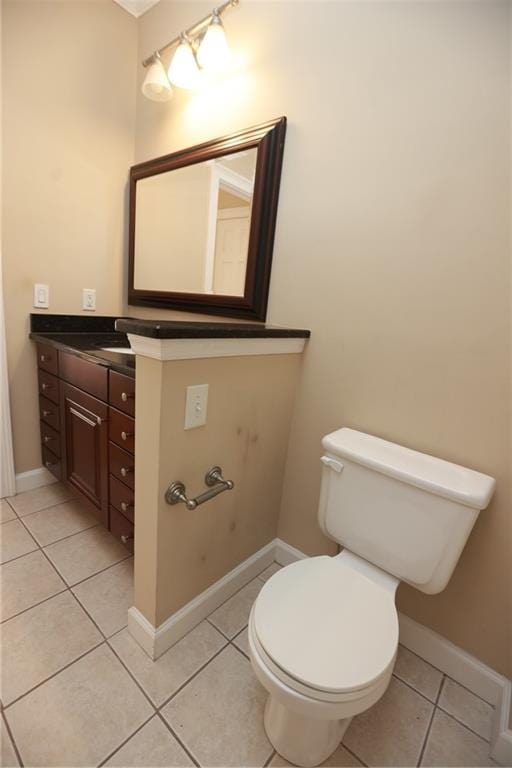 3541 Roswell Rd NE Unit 20, Atlanta, GA 30305 - bathroom featuring vanity, tile patterned floors, toilet, and baseboards