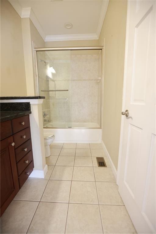 3541 Roswell Rd NE Unit 20, Atlanta, GA 30305 - full bath with crown molding, toilet, tile patterned floors, vanity, and bath / shower combo with glass door
