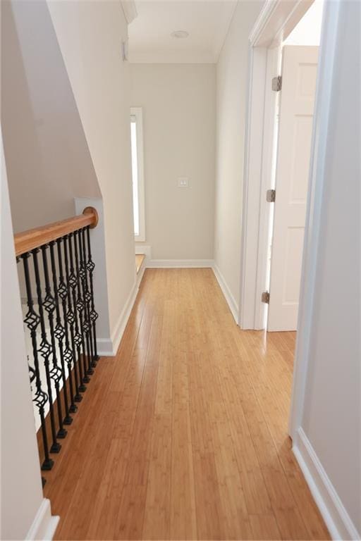 3541 Roswell Rd NE Unit 20, Atlanta, GA 30305 - hall with light wood finished floors, an upstairs landing, ornamental molding, and baseboards