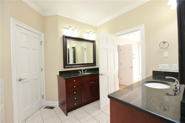 3541 Roswell Rd NE Unit 20, Atlanta, GA 30305 - bathroom with two vanities, tile patterned flooring, crown molding, and baseboards