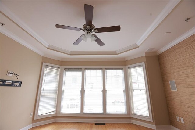 3541 Roswell Rd NE Unit 20, Atlanta, GA 30305 - spare room featuring a tray ceiling, ceiling fan, crown molding, and baseboards
