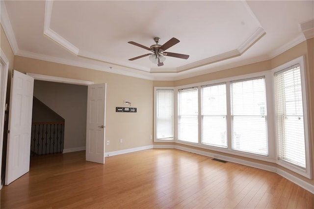 3541 Roswell Rd NE Unit 20, Atlanta, GA 30305 - unfurnished room featuring a tray ceiling, ceiling fan, plenty of natural light, and crown molding