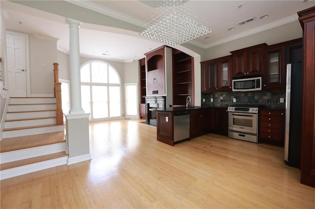 3541 Roswell Rd NE Unit 20, Atlanta, GA 30305 - kitchen with stainless steel appliances, dark countertops, open shelves, light wood-type flooring, and decorative backsplash