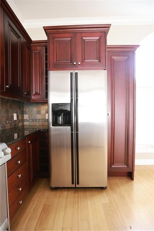 3541 Roswell Rd NE Unit 20, Atlanta, GA 30305 - kitchen featuring stainless steel refrigerator with ice dispenser, reddish brown cabinets, light wood-style flooring, and decorative backsplash