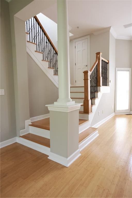 3541 Roswell Rd NE Unit 20, Atlanta, GA 30305 - staircase featuring wood finished floors, baseboards, and crown molding