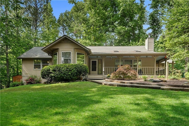 1920 Jett Ridge Rd, Cumming, GA 30041 - back of property featuring a chimney, a lawn, a porch, and roof with shingles