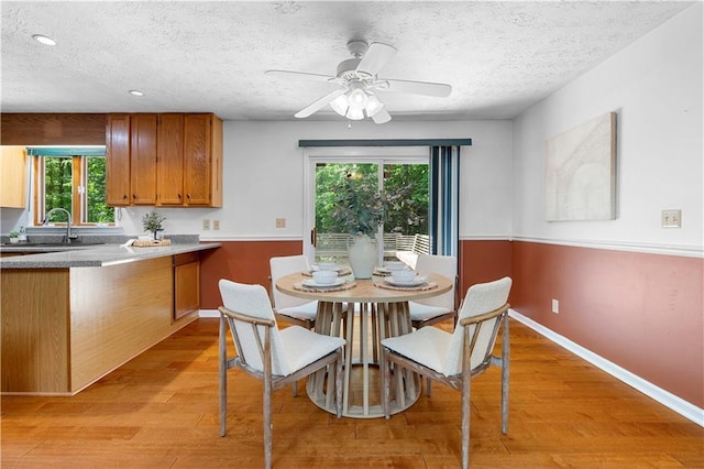 1920 Jett Ridge Rd, Cumming, GA 30041 - dining room with light wood-style floors, a textured ceiling, a ceiling fan, recessed lighting, and baseboards
