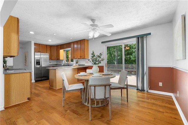 1920 Jett Ridge Rd, Cumming, GA 30041 - dining area featuring light wood-style floors, baseboards, a ceiling fan, a textured ceiling, and recessed lighting