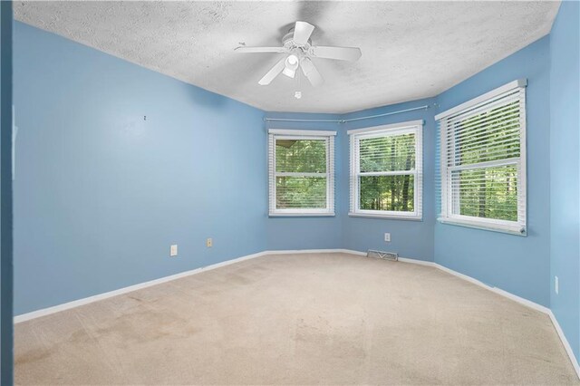 1920 Jett Ridge Rd, Cumming, GA 30041 - carpeted spare room featuring a textured ceiling, baseboards, and ceiling fan