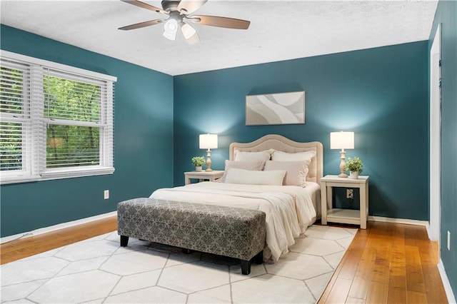 1920 Jett Ridge Rd, Cumming, GA 30041 - bedroom featuring light wood-style floors, baseboards, and ceiling fan