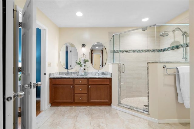 1920 Jett Ridge Rd, Cumming, GA 30041 - bathroom with a stall shower, double vanity, baseboards, and recessed lighting