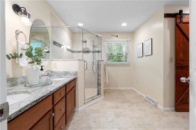 1920 Jett Ridge Rd, Cumming, GA 30041 - bathroom featuring a stall shower, double vanity, baseboards, and recessed lighting