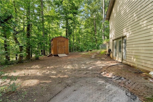 1920 Jett Ridge Rd, Cumming, GA 30041 - view of yard featuring a storage shed and an outdoor structure