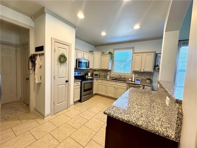 kitchen featuring decorative backsplash, light stone countertops, appliances with stainless steel finishes, and crown molding