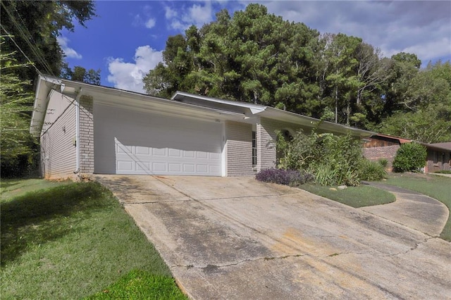 single story home with a front lawn and a garage