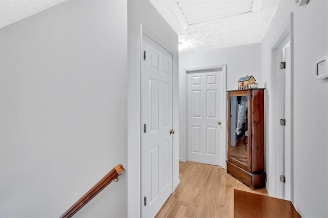 40 Picketts Forge Dr W, Acworth, GA 30101 - corridor featuring light wood-type flooring, a textured ceiling, and an upstairs landing
