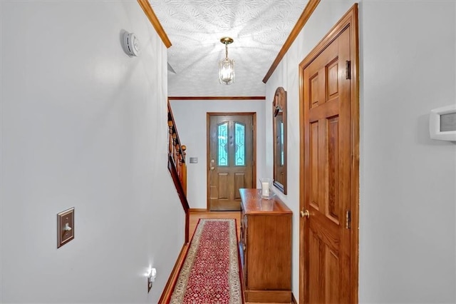 40 Picketts Forge Dr W, Acworth, GA 30101 - doorway to outside featuring baseboards, crown molding, and a textured ceiling