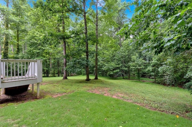 40 Picketts Forge Dr W, Acworth, GA 30101 - view of grassy yard with a wooden deck and a view of trees